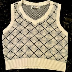 White, Gray, and Black plaid sweater vest from holster. Size M.